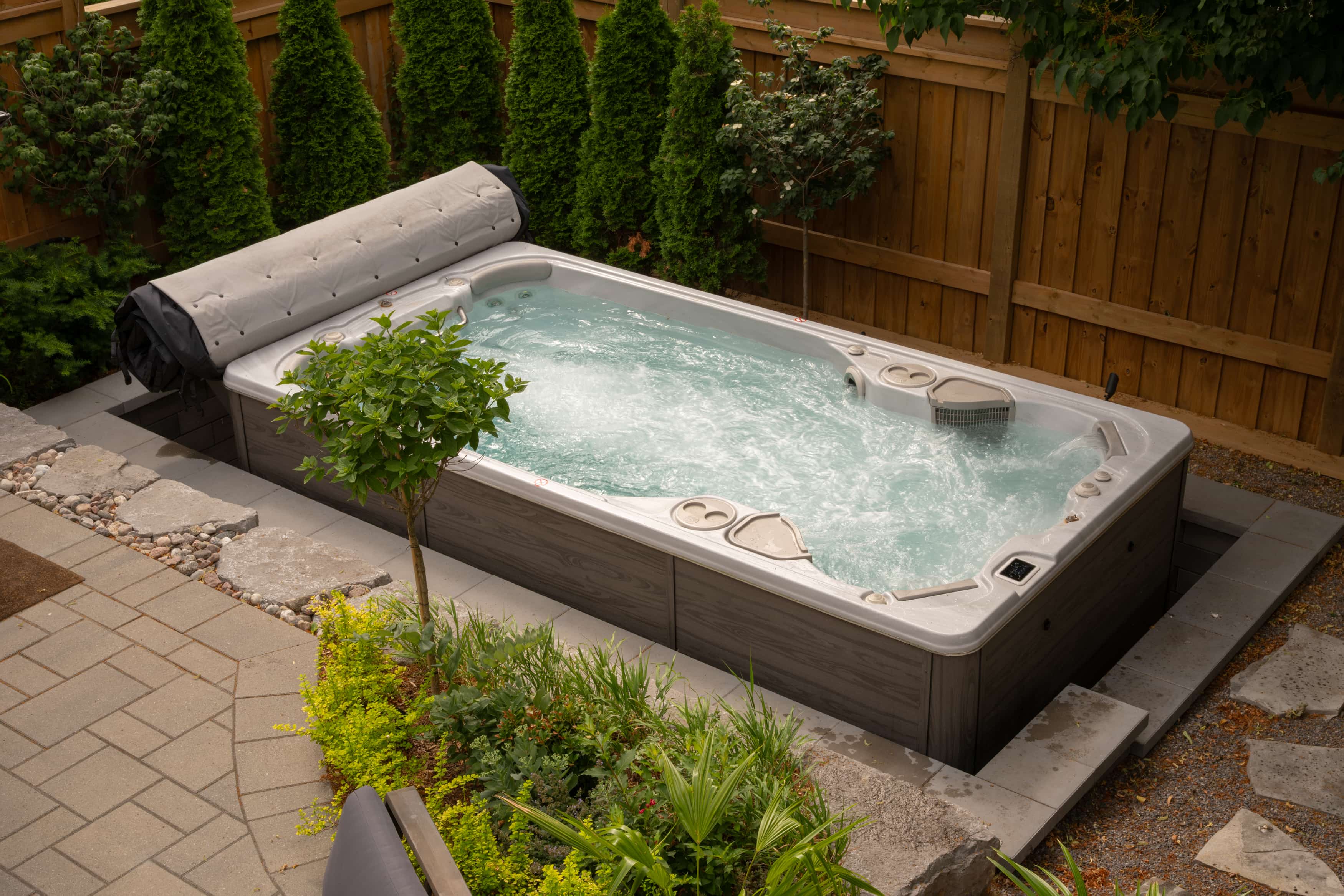 Luxury swim spa in premium backyard setting